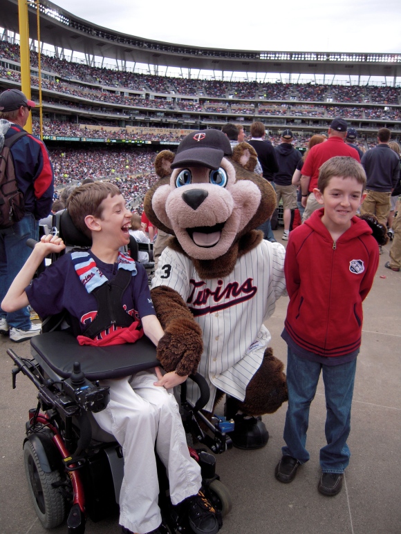 12 year old Justin and his brother with the Twins mascot at Twins Stadium