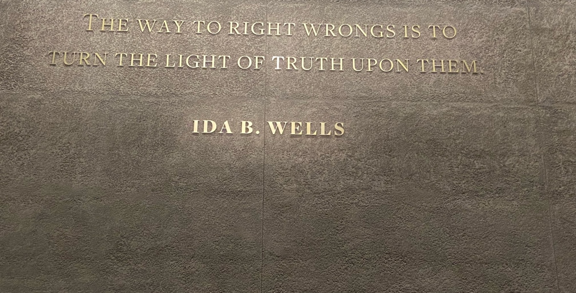 Quote by Ida B. Wells on wall: "The way to right wrongs is to turn the light of truth upon them."